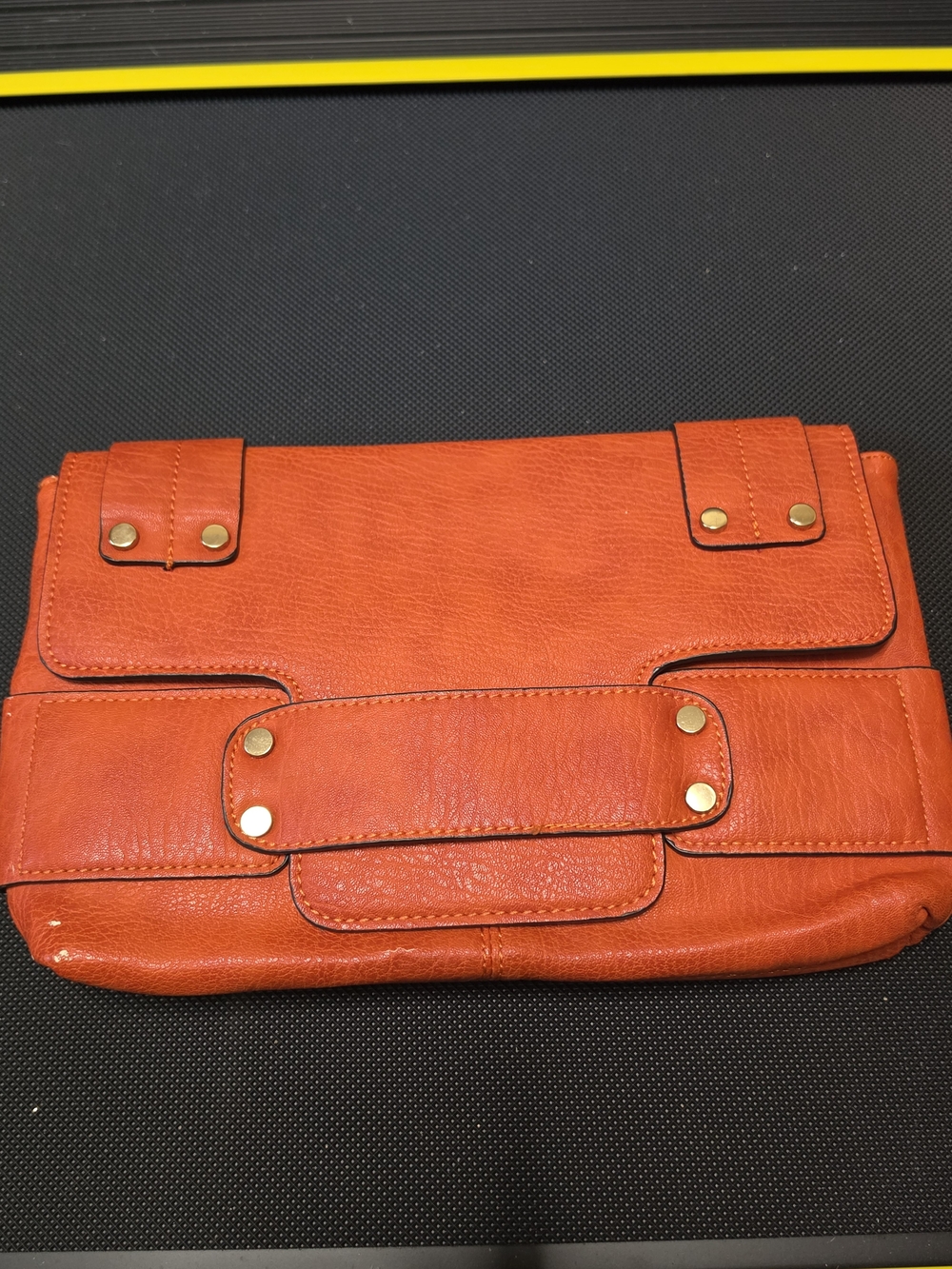 Poppie Jones Orange Leather Fold-Over Clutch with Brass Accents